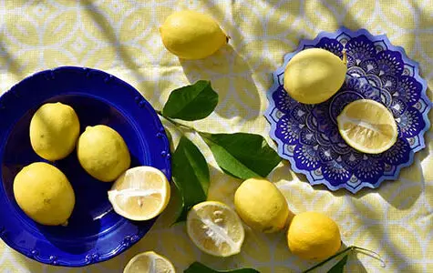 Lemons,On,Dishes,On,Yellow,Tablecloth.,Top,View