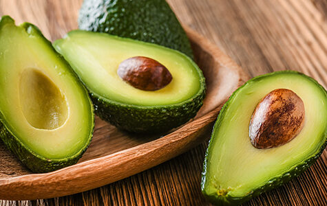 Avocado,On,Old,Wooden,Table.halfs,On,Wooden,Bowl.,Fruits,Healthy